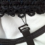 be carefully taking off the garters